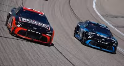 Bubba Wallace greets Christopher Bell after Shane Van Gisbergen wins at Watkins Glen
