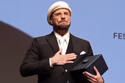 John Travolta Cannes Film Festival surprise honor steals premiere spotlight