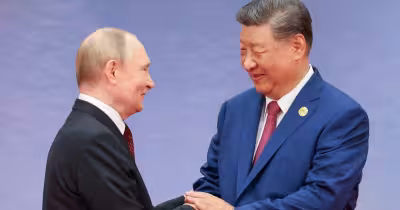 Putin arrives in Beijing as Russia, China deepen ties and energy talks