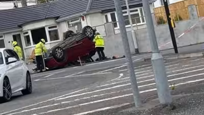 Plymouth Live: Car lands on roof after crash near Woodford Avenue