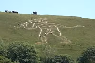 Cerne Abbas giant gets fresh chalk as warmer, wetter weather takes a toll