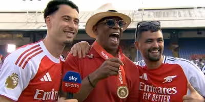 Ian Wright joins Arsenal title celebrations as Gabriel Martinelli puts medal around his neck