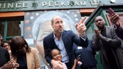 William, Prince Of Wales pulls a half pint at The Prince of Peckham