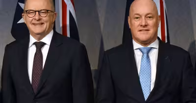 Albanese and Luxon trade jokes over Capital Gains Tax row in Noosa