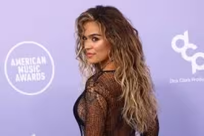 Karol G turns heads in gold fringe top at surprise Stockholm concert