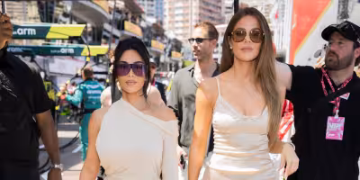 Kim Kardashian returns to Monaco Grand Prix in cream gown and purple shades — The Sun Uk