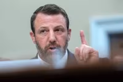 Markwayne Mullin seen with pink stress ball in tense House hearing