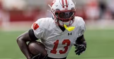 Eugene Hilton Jr. uses his birth name at Wisconsin as NFL ties loom